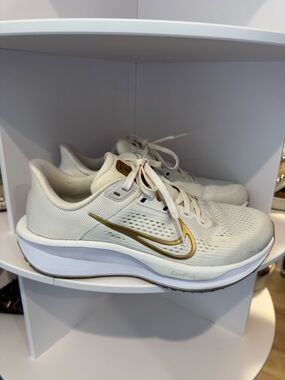Nike Women's Cream Running Sneakers with Gold Swoosh